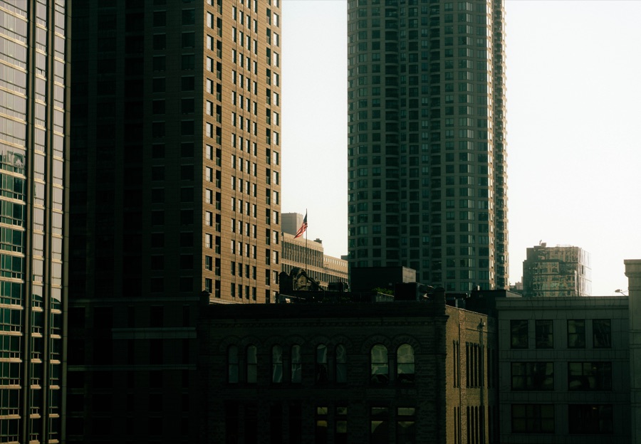 Golden light across layered city buildings
