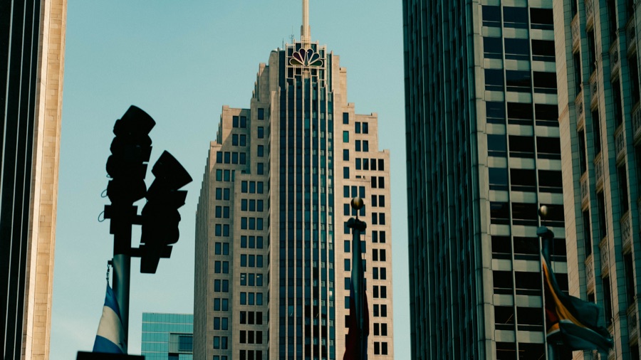 Art Deco architecture framed by traffic lights