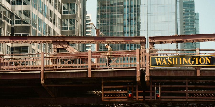 A pedestrian on Washington Street bridge