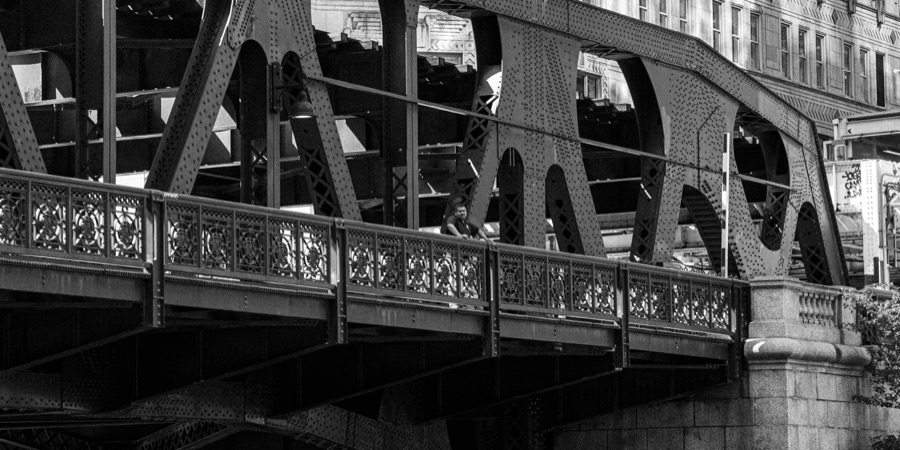 Steel bridge geometry and a person at the railing