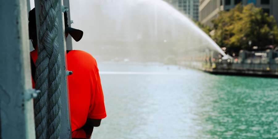 A vivid orange shirt beside the Chicago River