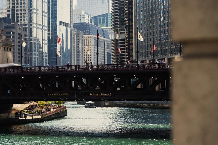 Flags and pedestrians over the Chicago River